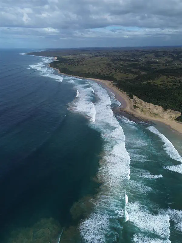 Surf along the empty beach