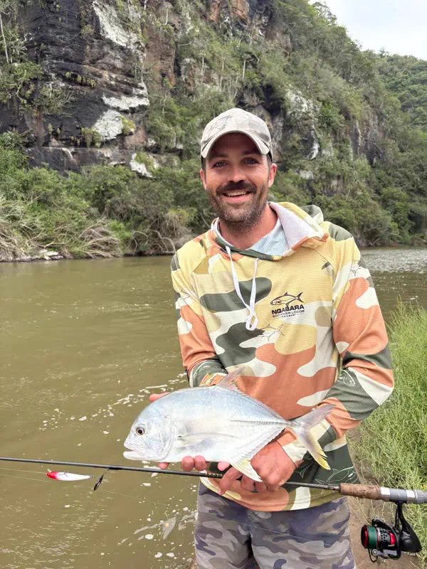 Fishing below the river cliffs