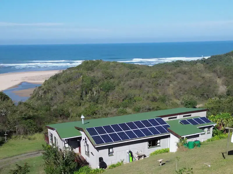 The main house and its solar panels